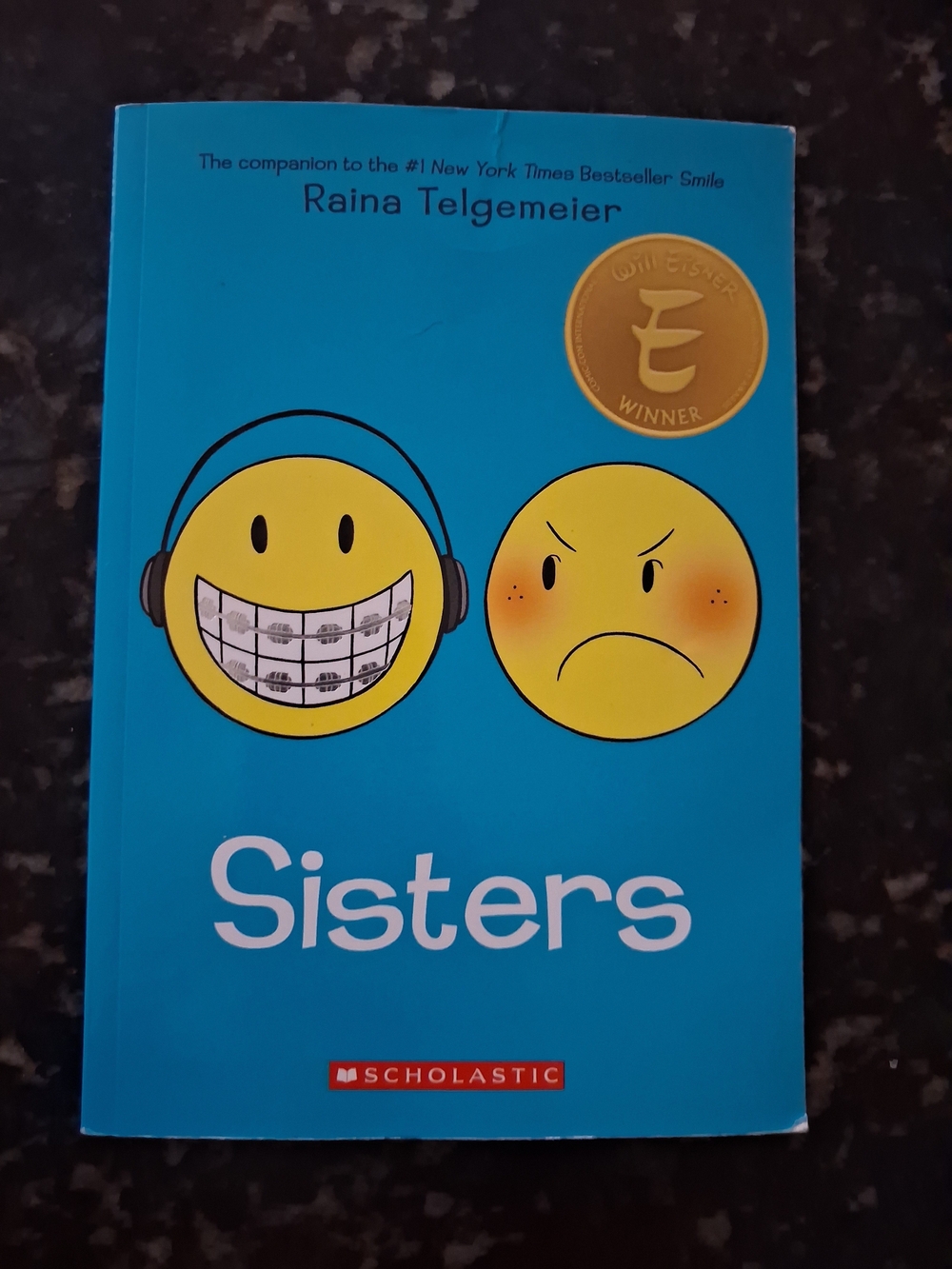 Sisters by Raina Telgemeier - Bright Blue Cover
